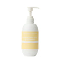 White lotion bottle with a yellow label on a white background